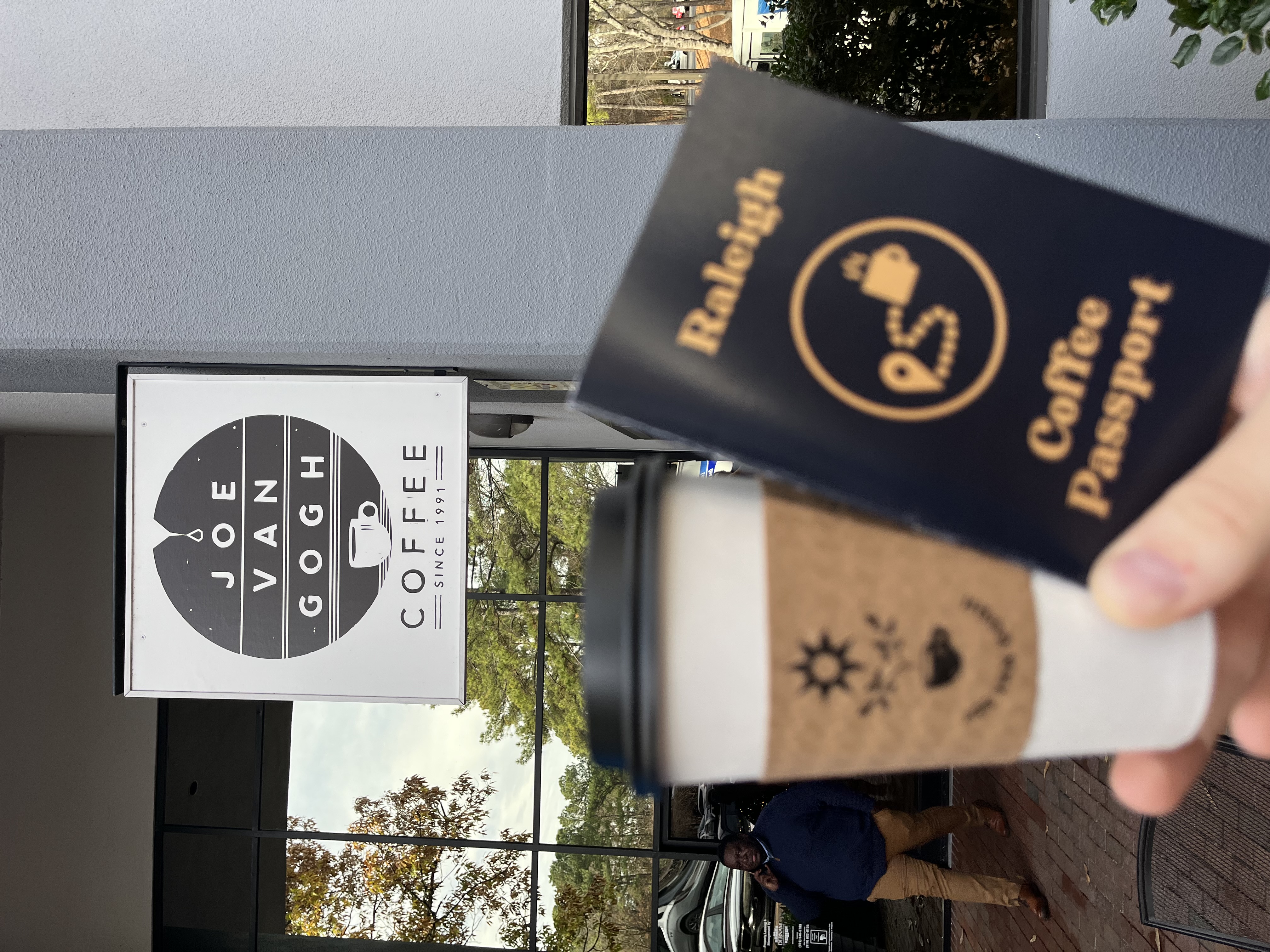 Raleigh Coffee Passport and a drink