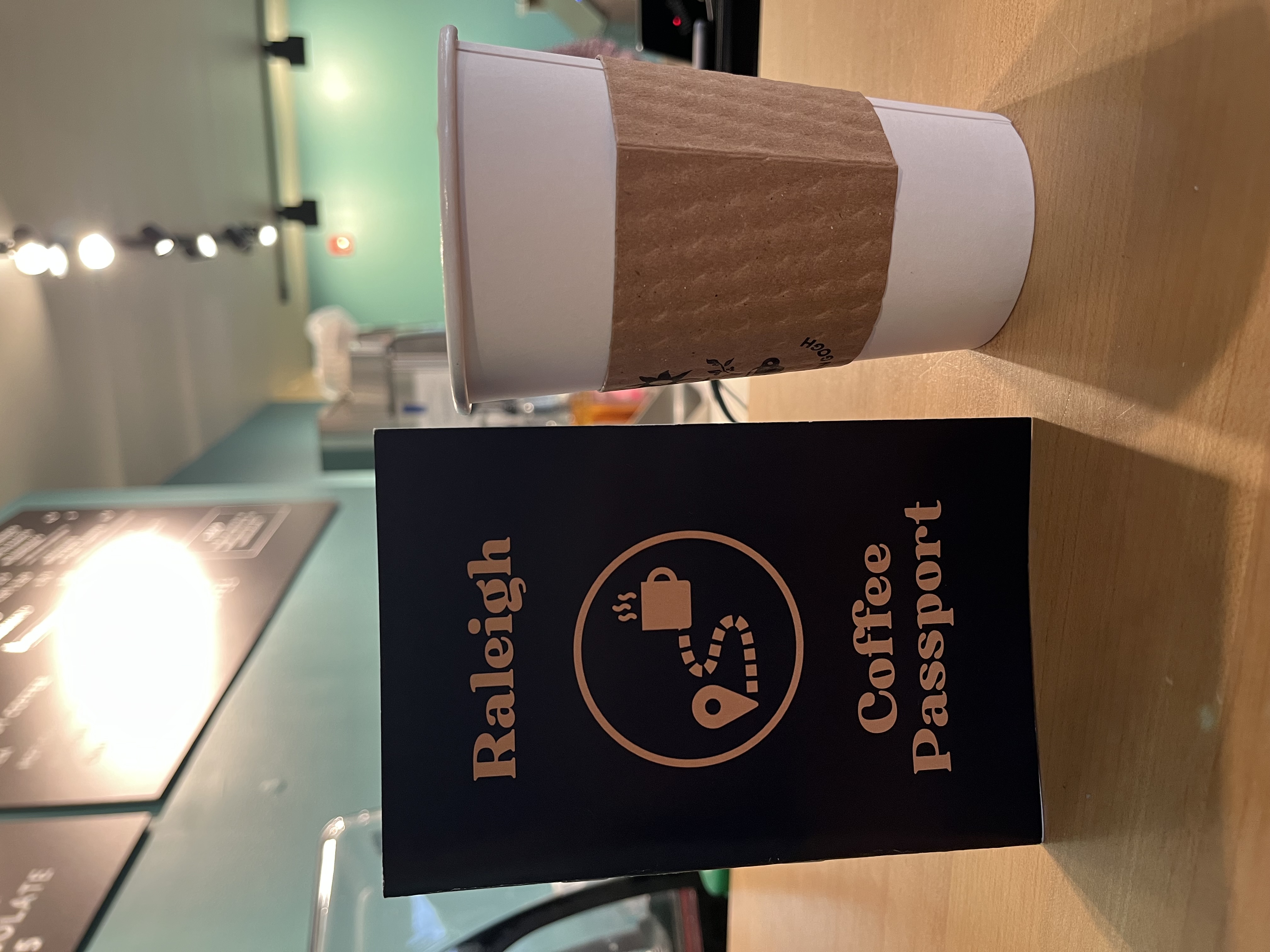 Raleigh Coffee Passport and a drink
