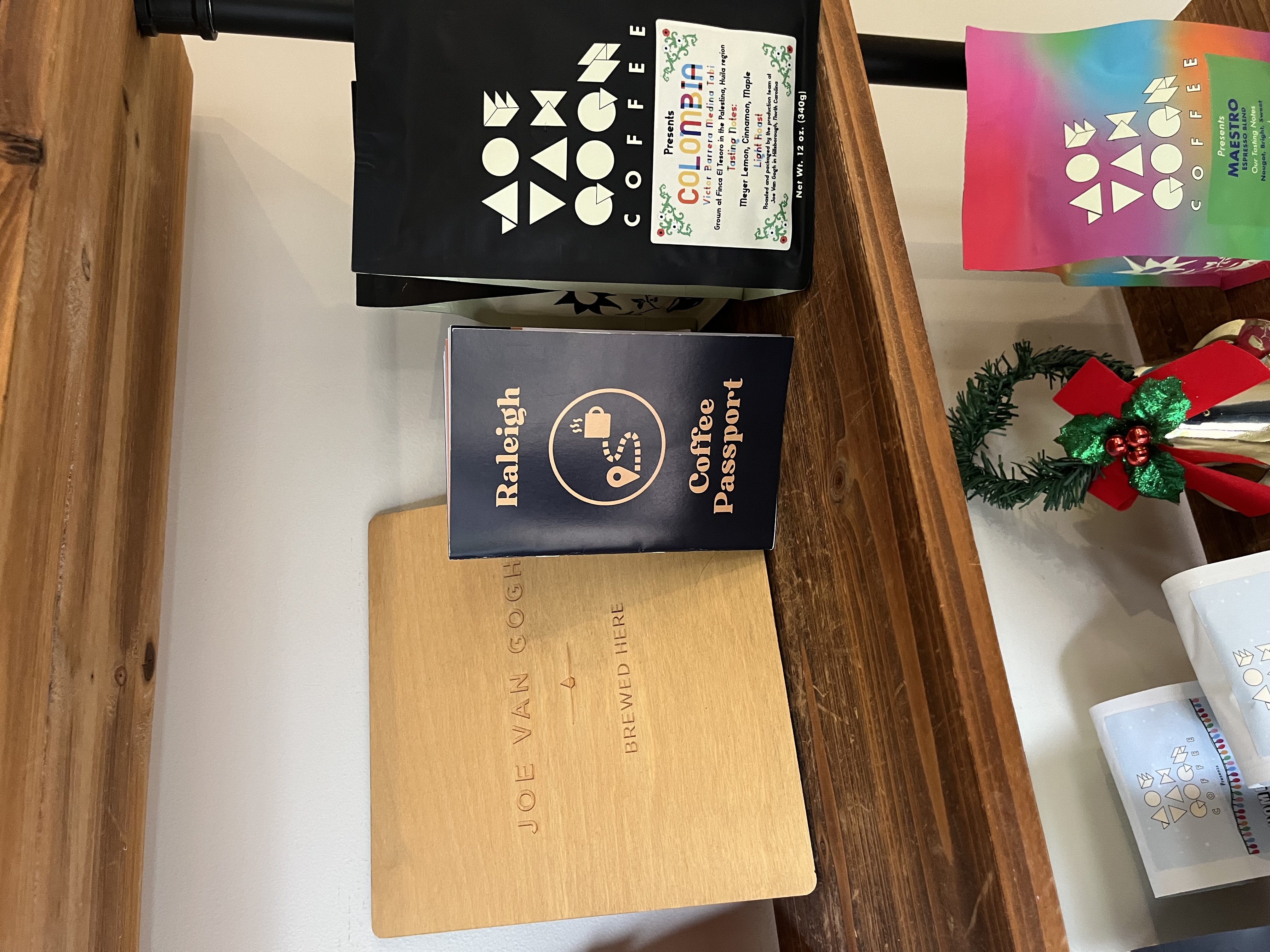 Raleigh Coffee Passport and bags of coffee beans