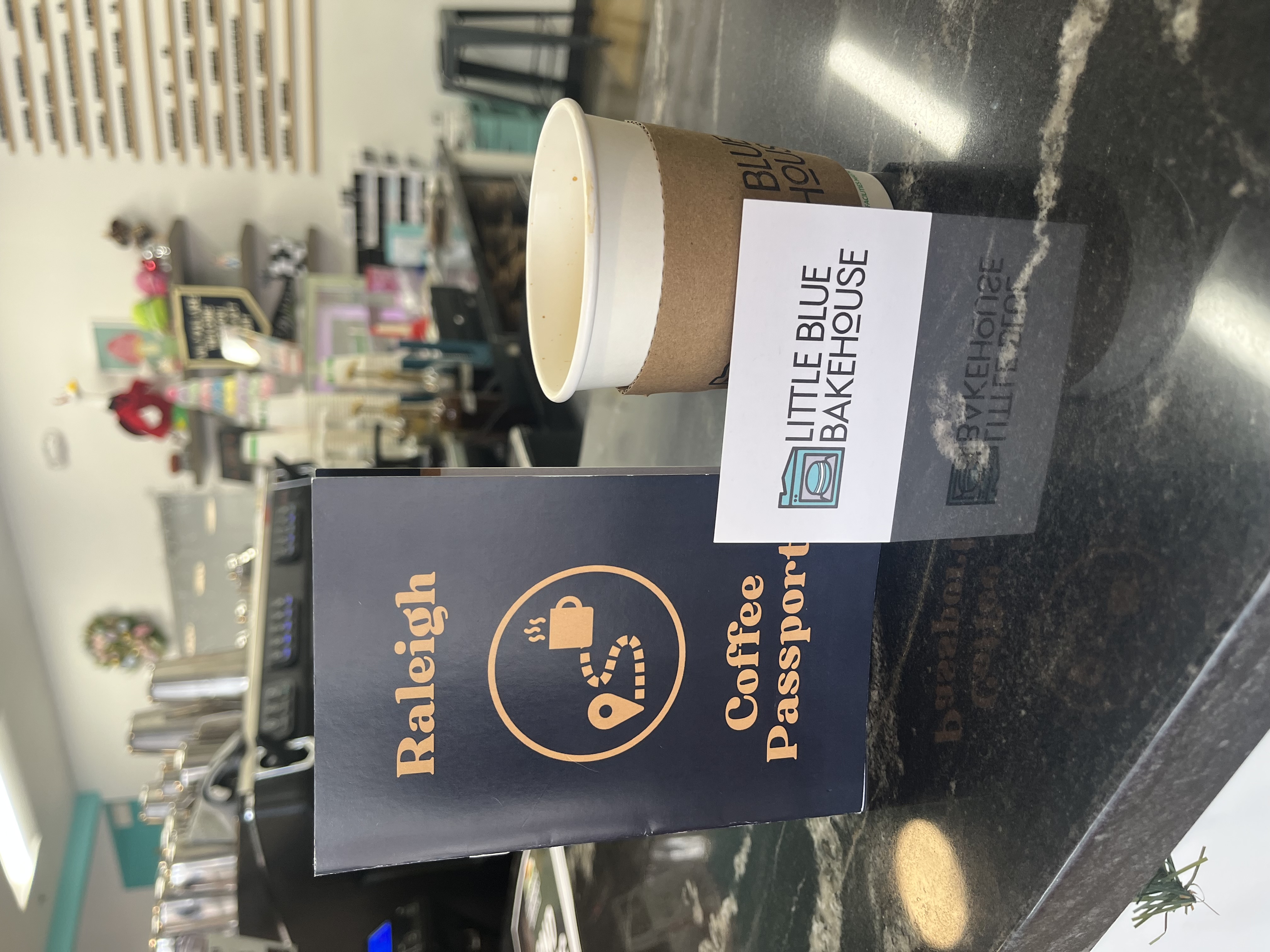 Raleigh Coffee Passport and a drink and a Little Blue Bakehouse Business Card