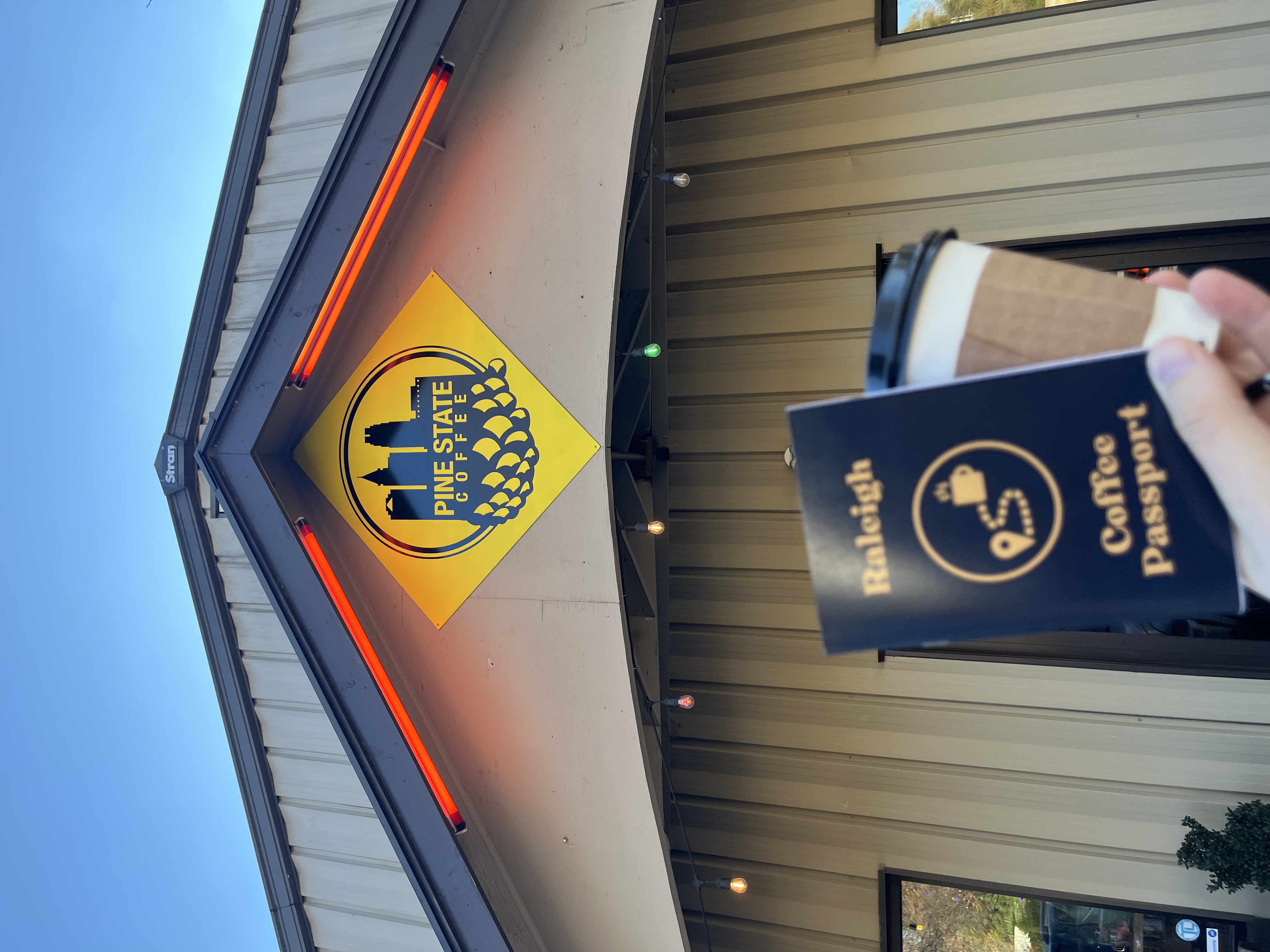 Raleigh Coffee Passport and a drink