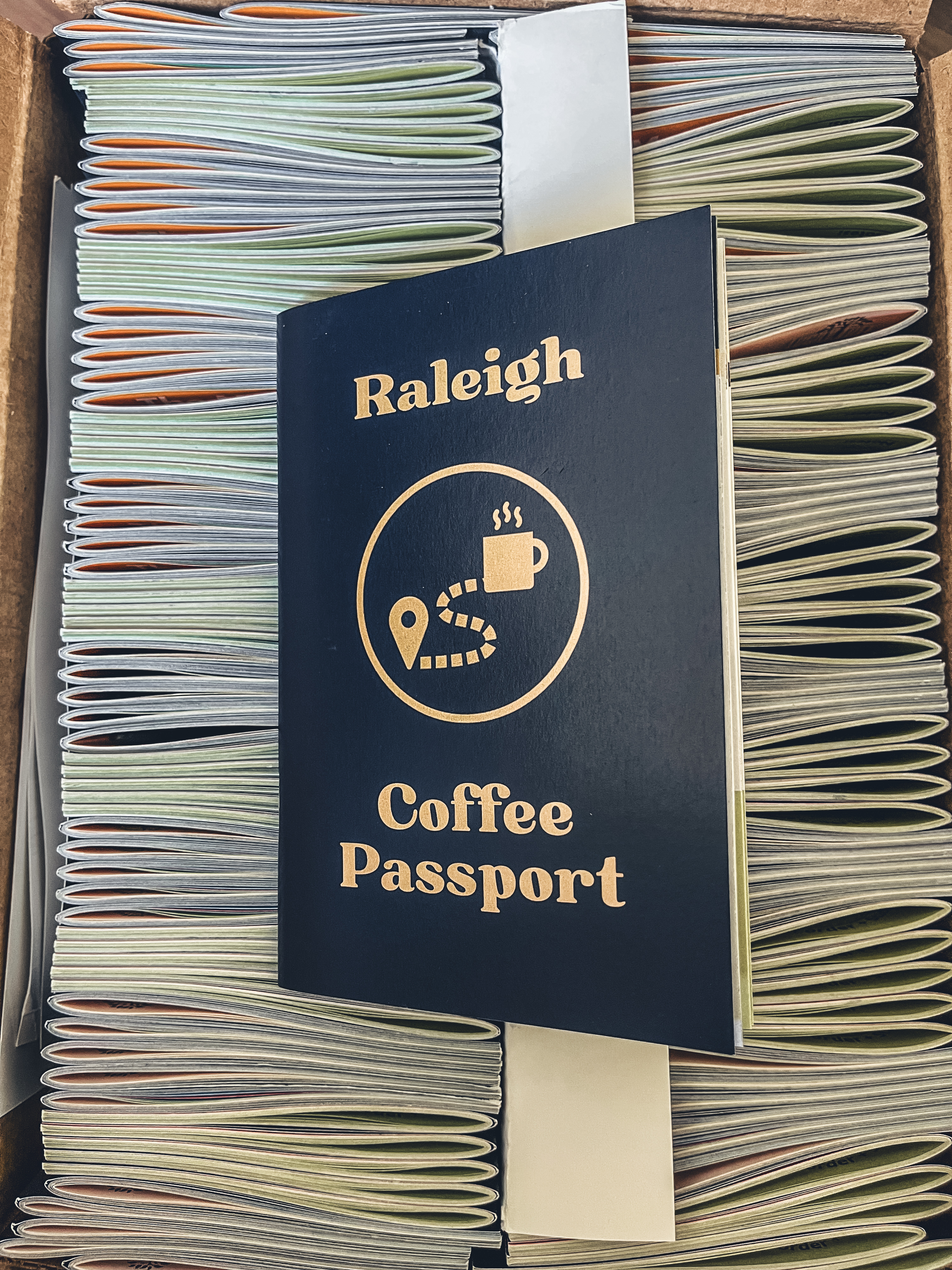 Raleigh Coffee Passports in a box, one on top