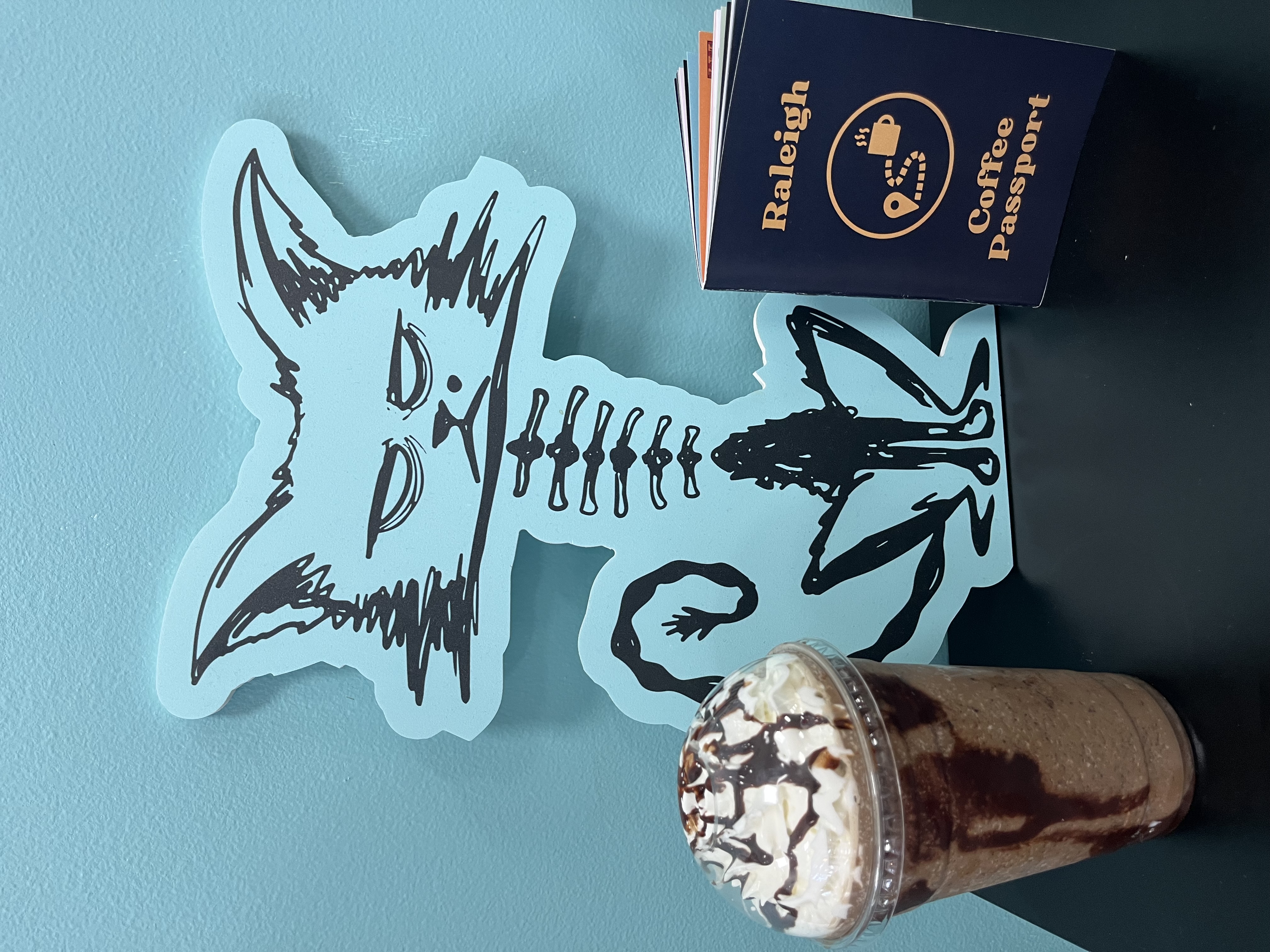 Raleigh Coffee Passport and a drink